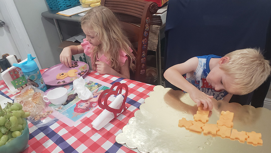 Milovanska-Farrington's children create a lion and puzzle pieces out of cantaloupe.