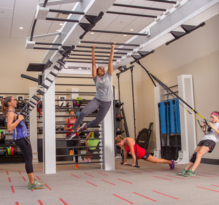 women stretching, lifting weights, and climbing on monkey bars 