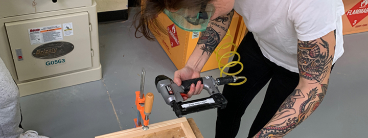 Person using a nail gun