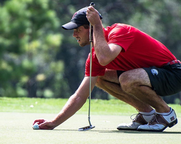 Student playing golf