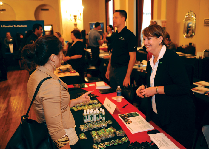 People conversing at a job fair