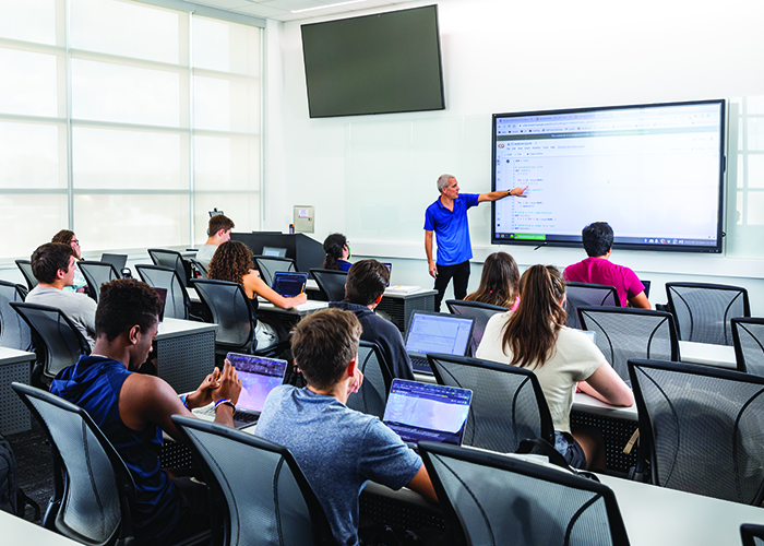 Professor teaching computer science class