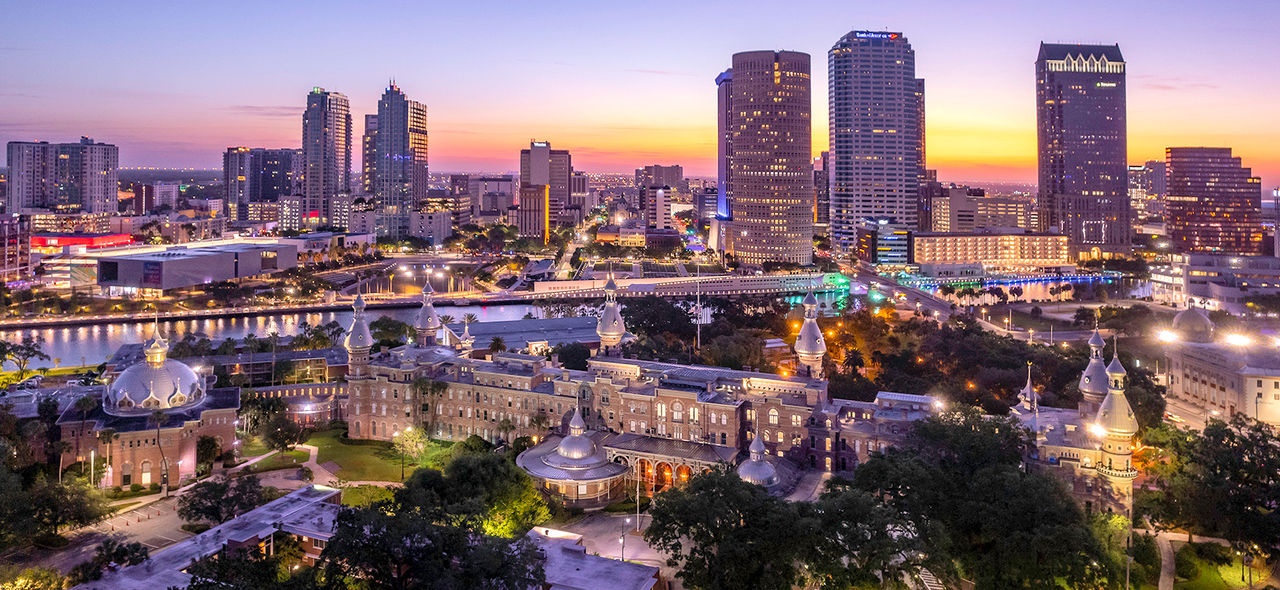 Sunset photo of downtown Tampa with UT in the foreground.