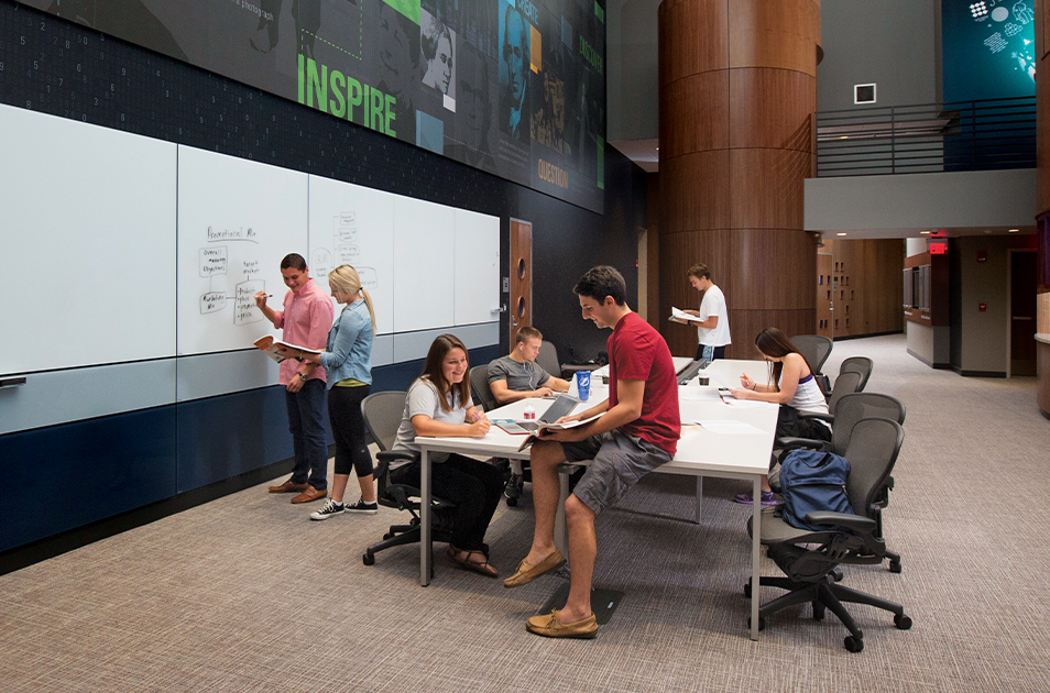  STUDENTS ARE SHOWN IN THE LOWTH ENTREPRENUERSHIP CENTER ON THE UT CAMPUS.