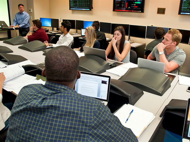Students in class working toward an economics degree